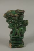 A CHINESE GREEN GLAZED POTTERY LION DOG, 17cm high.