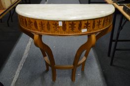A inlaid satin wood demi-lune and marble topped console table.