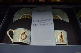 A set of four Wedgwood pairs of coffee cups and saucers commemorating four decades.