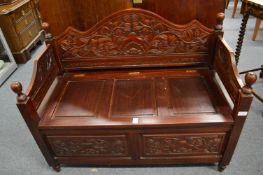 Carved mahogany settle.