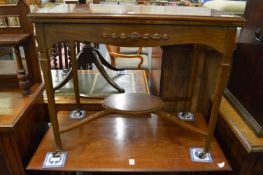 A mahogany fold-over card table.