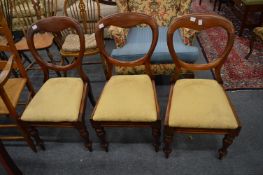Three Victorian balloon back dining chairs.
