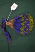 A bead work evening purse with gilt metal mounts.