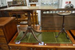 An oak occasional table and a mahogany wine table.