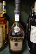 Courvoisier cognac, a 1.5 litre bottle together with a bottle of Martell cognac.