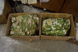 A quantity of floral loose covers for a sofa.