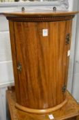 A small mahogany hanging bow fronted corner cupboard.