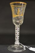 A good Continental engraved and gilded wine glass with opaque and coloured air twist stem.