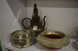 An Eastern ewer, a slave bangle dish and a plated decanter coaster.