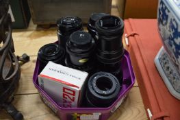 A collection of camera lenses.