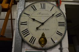 Decorative circular wall clock.