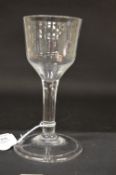 A Georgian wine glass with plain bowl and stem.