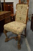 Carved oak and upholstered side chair.