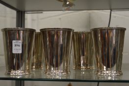 A set of five plated beakers.