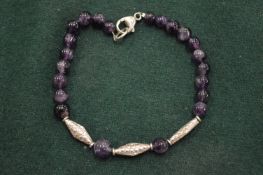 Decorative silver and amethyst necklace.