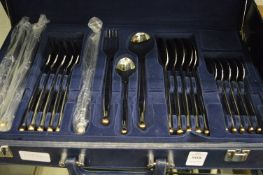 A suitcase containing cutlery.
