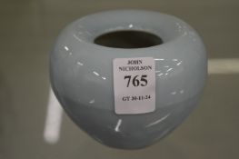 A small pale blue glazed ink pot.