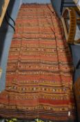 A Kilim style rug, 300cm x 120cm.