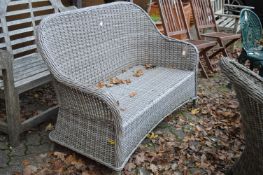 A matching settee with cushion.