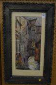 A canal scene with timber framed buildings, watercolour, in a decorative frame.
