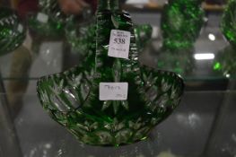 A Bohemian cut glass and green tinted flower basket.