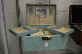 A good green leather jewellery box.