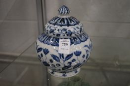 A Chinese blue and white decorated jar and cover.