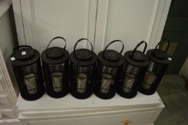 A set of six solar powered lanterns.