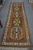A good Persian design runner, 332cm x 95cm.