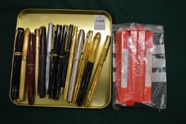 A Mont Blanc ballpoint pen, a Parker Duofold fountain pen and various other pens and accessories.