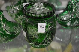 Bohemian cut glass and green tinted jar and cover.