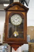 A mahogany cased wall clock.