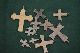 Small bronze crucifixes.