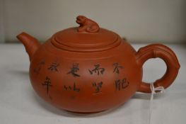 Two Chinese Yixing teapots.