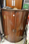 19th century mahogany hanging bow fronted corner cupboard.