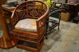 A bamboo chair and a drinks trolley.