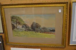 M Lanciani, View across a field with sail boats in a bay beyond, watercolour.