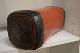 A Chinese lacquer pillow.