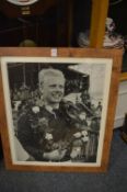A large photographic print of the racing driver Michael Hawthorn with facsimile signature together