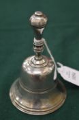 A Victorian silver table bell.