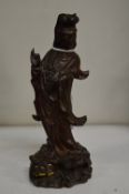 A small Chinese carved wood figure of Wang Ying.