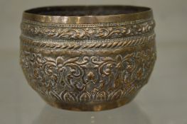 An Indian white metal bowl with engraved decoration.