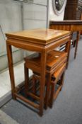 Three Chinese redwood occasional tables.
