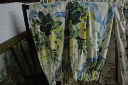 A pair of floral curtains, lined approx size 80cm wide x 132cm long.