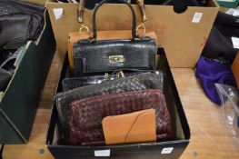 Six crocodile and other leather handbags.