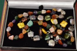 Three decorative boxed necklaces.