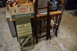 Two small green painted folding step ladders, another ladder and a folding chair.