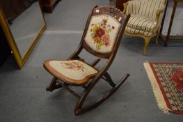 A folding rocking chair.
