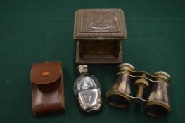 A decorative French metal casket, opera glasses and a cased scent bottle.
