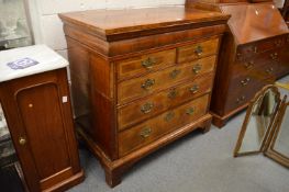 A Georgian walnut and oak straight front chest of drawers, sides cut.